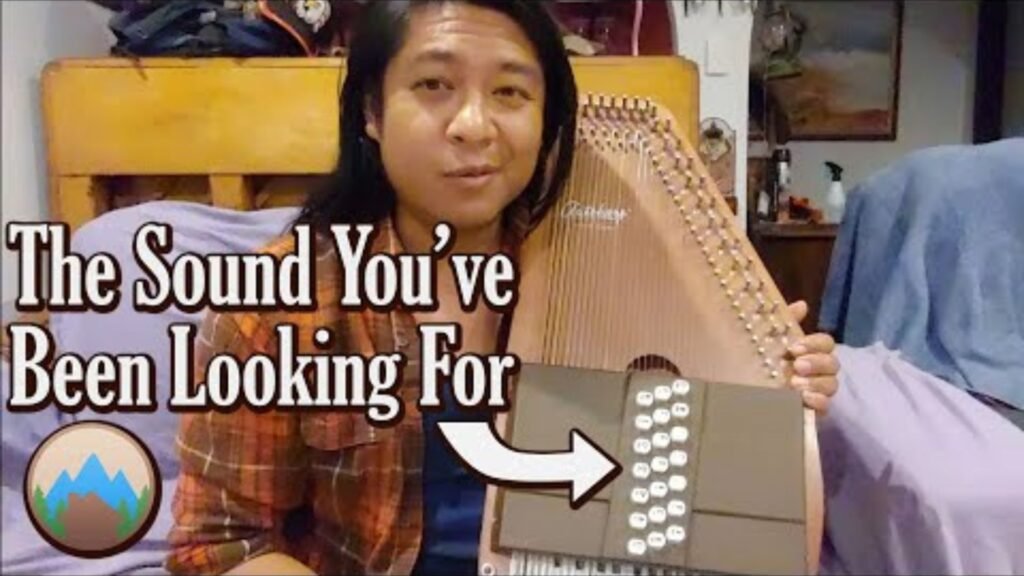 A man playing holding an autoharp playing the Top Autoharp Music Styles